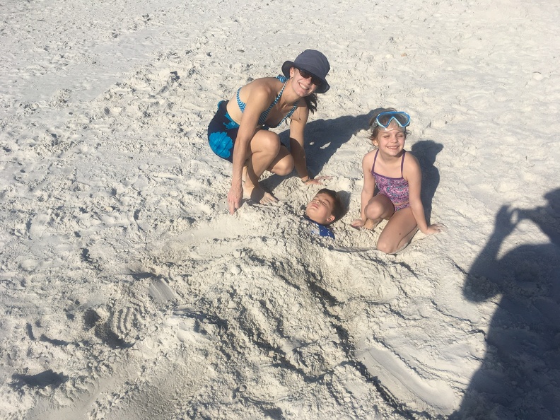 Burying JB in the sand.jpeg